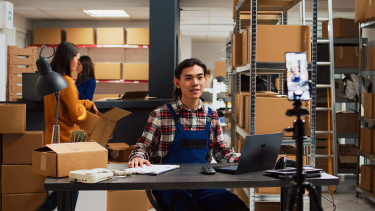 asian worker recording ad video in storage room 2023 11 27 05 22 07 utc (1)